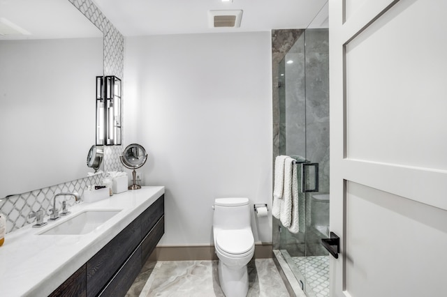 bathroom with vanity, an enclosed shower, and toilet