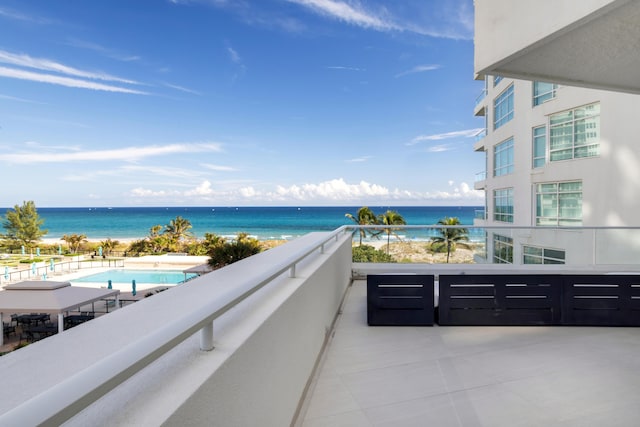 balcony featuring a water view