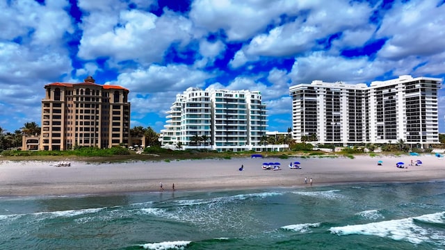 exterior space featuring a view of the beach and a water view