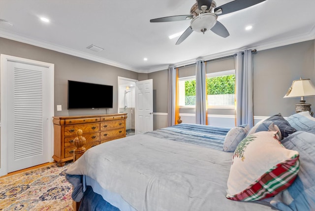 bedroom with ceiling fan, wood-type flooring, and ornamental molding