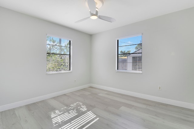 unfurnished room featuring ceiling fan and light wood-type flooring