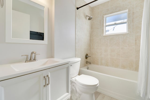 full bathroom with wood-type flooring, vanity, toilet, and tiled shower / bath