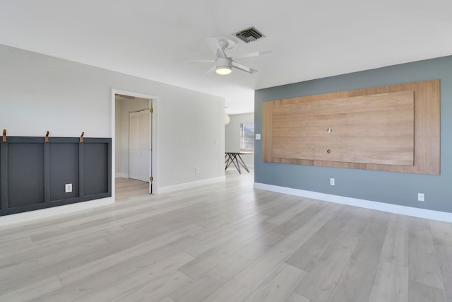 spare room featuring light hardwood / wood-style floors and ceiling fan