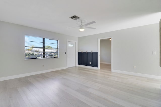 spare room with ceiling fan and light hardwood / wood-style floors