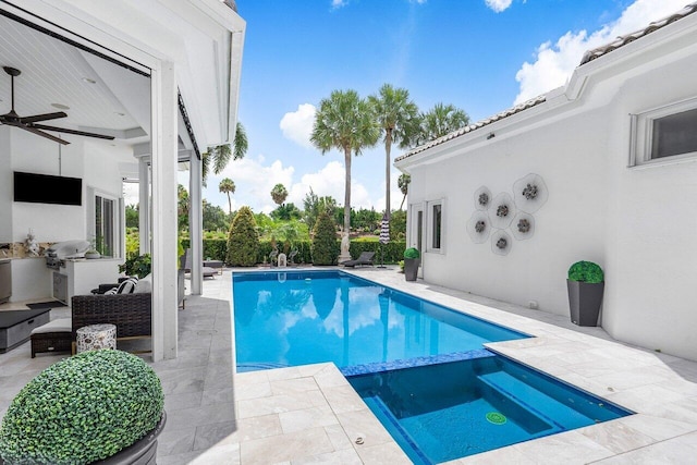 view of pool featuring an in ground hot tub, a patio, and ceiling fan