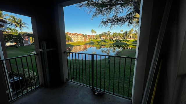 balcony featuring a water view