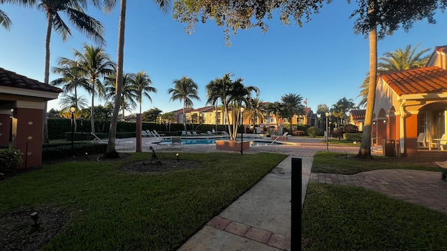 view of yard featuring a patio and a community pool