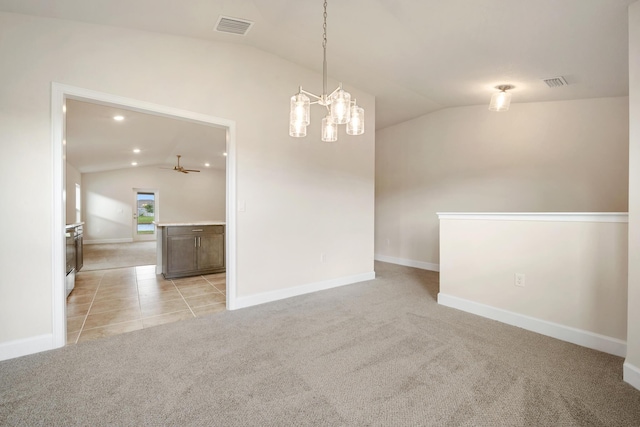 carpeted empty room with lofted ceiling and ceiling fan with notable chandelier