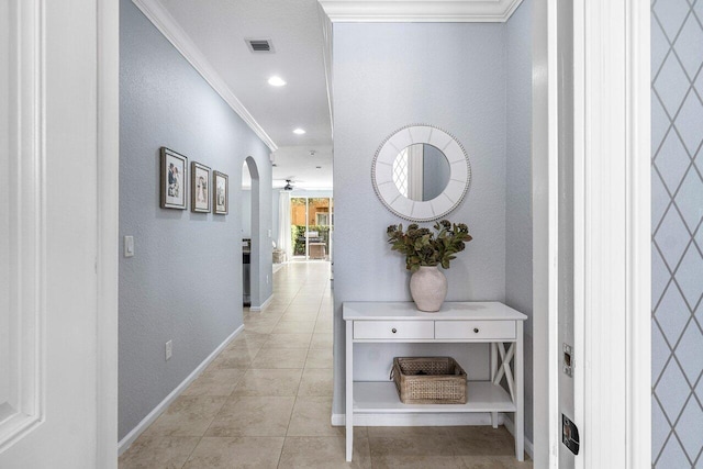 corridor featuring light tile patterned flooring and crown molding