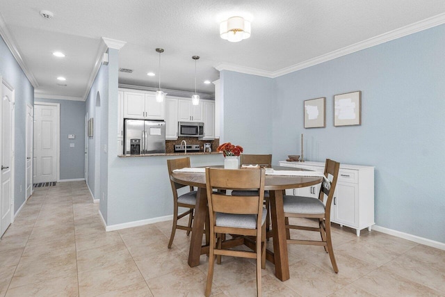 dining space featuring crown molding and a textured ceiling