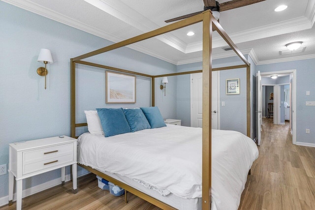 bedroom with ceiling fan, crown molding, and light wood-type flooring