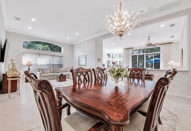 dining space with light tile patterned floors, ceiling fan with notable chandelier, and crown molding