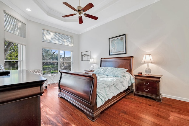 bedroom with ceiling fan, crown molding, and hardwood / wood-style flooring