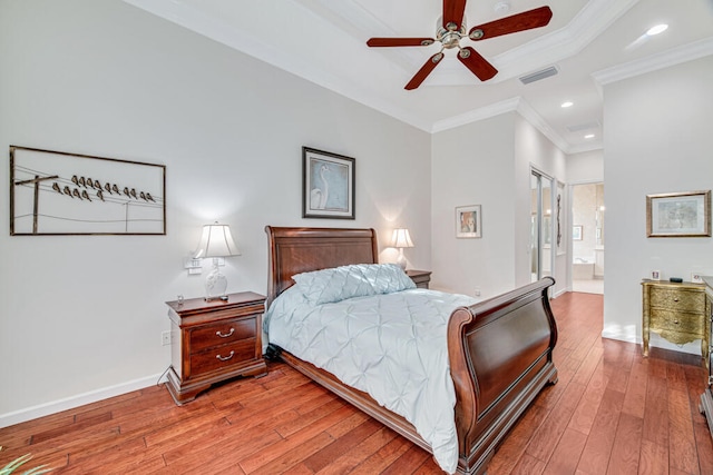 bedroom with ensuite bathroom, ceiling fan, wood-type flooring, and ornamental molding