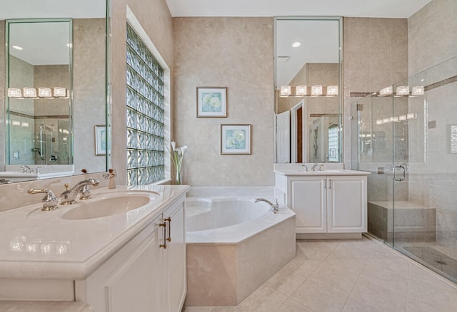 bathroom featuring tile patterned flooring, vanity, and separate shower and tub