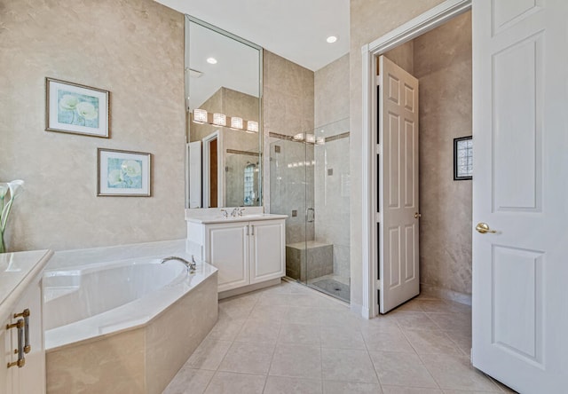 bathroom with tile patterned flooring, vanity, and independent shower and bath