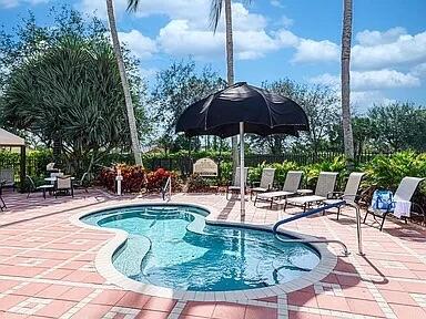 view of swimming pool with a patio area