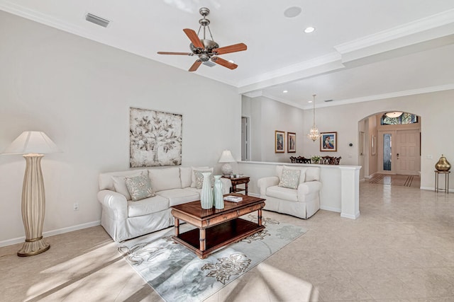 living room featuring ceiling fan and ornamental molding