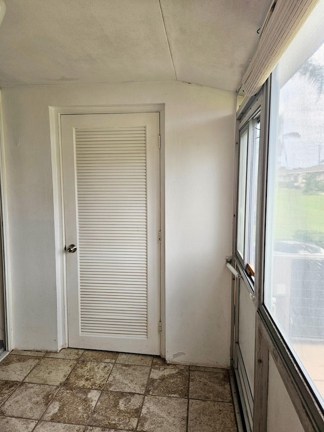 entryway with vaulted ceiling