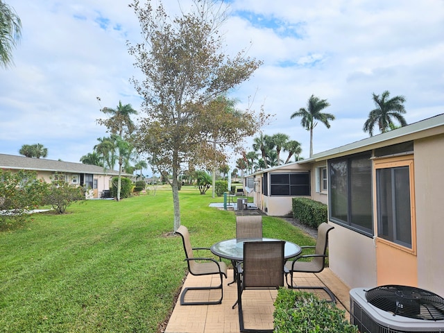 view of yard featuring central AC unit and a patio area