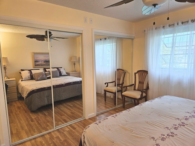 bedroom featuring ceiling fan, wood-type flooring, and a textured ceiling