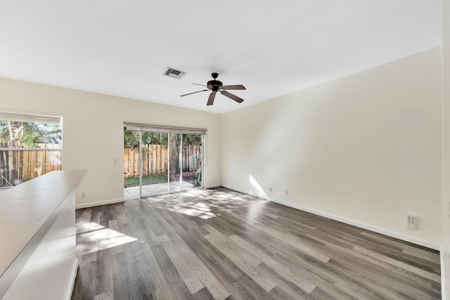 spare room with hardwood / wood-style floors, plenty of natural light, and ceiling fan