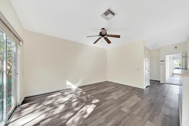 unfurnished living room featuring hardwood / wood-style floors and ceiling fan