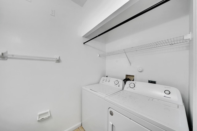 washroom featuring washing machine and clothes dryer