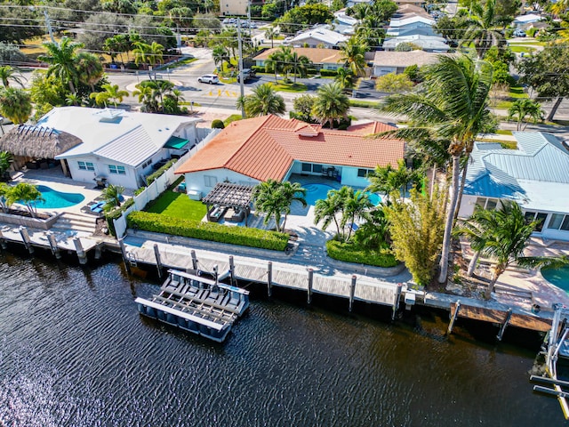 birds eye view of property featuring a water view