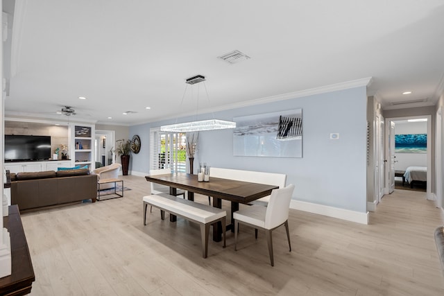 dining space featuring ceiling fan, light hardwood / wood-style floors, and ornamental molding