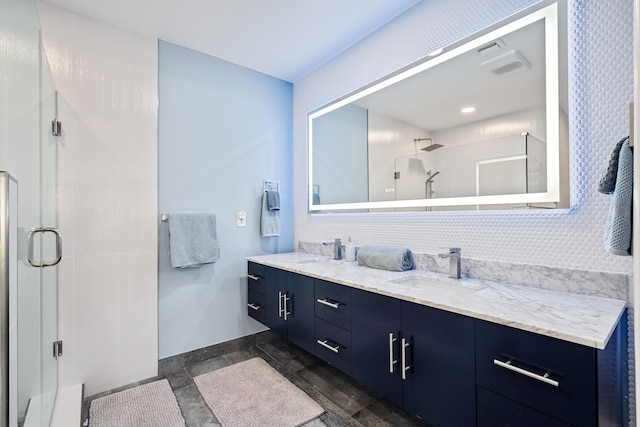 bathroom with hardwood / wood-style floors, vanity, and walk in shower