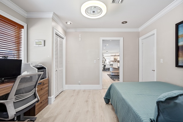 bedroom with ornamental molding and light wood-type flooring