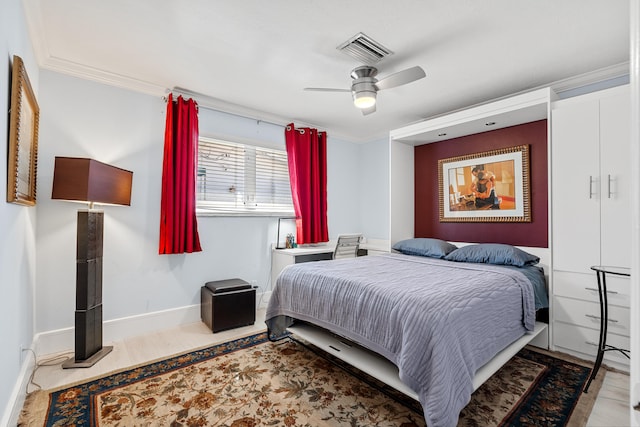 bedroom with ceiling fan and crown molding