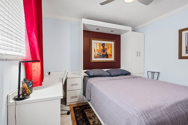 bedroom with ceiling fan, light wood-type flooring, and ornamental molding