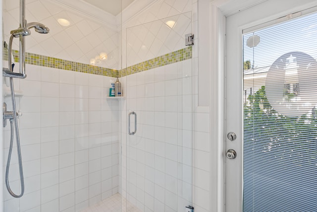 bathroom with a shower with door