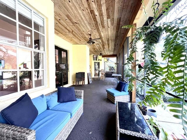 view of patio with ceiling fan and an outdoor living space