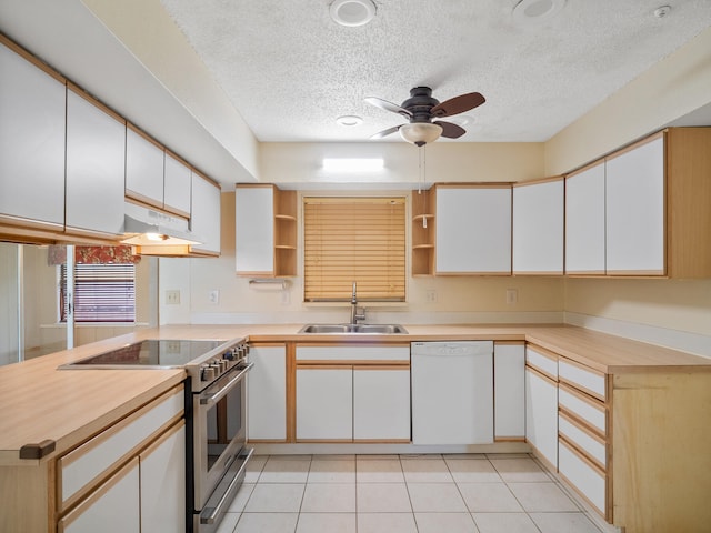 kitchen featuring dishwasher, electric stove, sink, kitchen peninsula, and white cabinetry