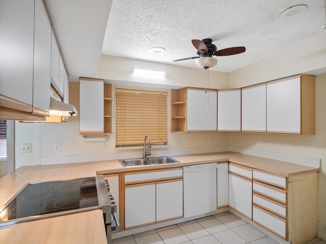 kitchen with a textured ceiling, white dishwasher, sink, range, and white cabinetry