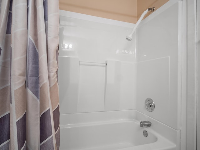 bathroom with shower / tub combo with curtain