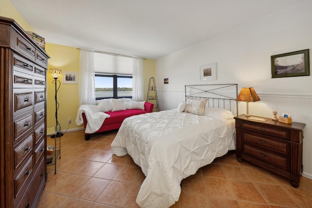 bedroom featuring light tile patterned floors