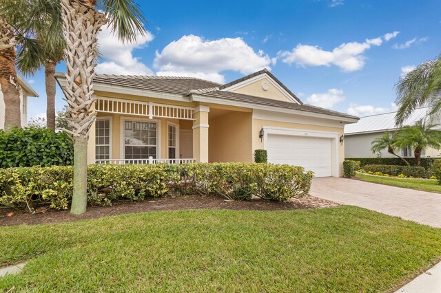 view of front facade featuring a garage and a front lawn