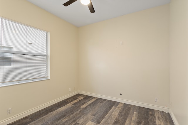 unfurnished room with ceiling fan and dark wood-type flooring