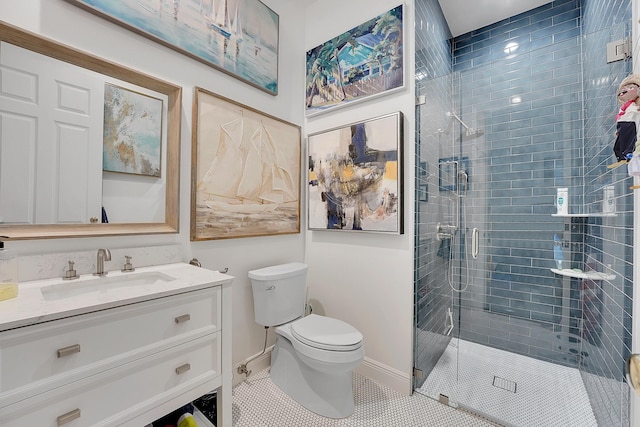 bathroom with toilet, vanity, tile patterned floors, and an enclosed shower