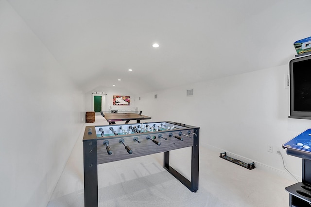 playroom featuring light colored carpet and lofted ceiling