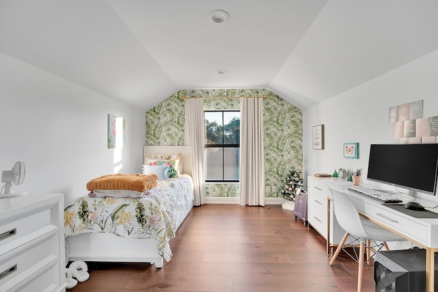 bedroom with dark wood-type flooring and vaulted ceiling