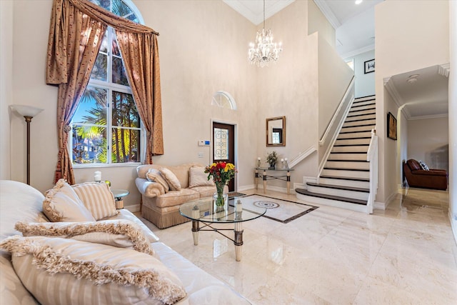 living room featuring a chandelier, a high ceiling, and ornamental molding