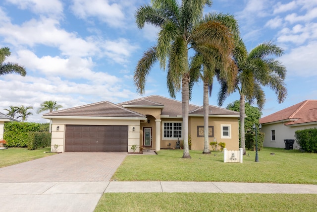 view of front facade with a garage and a front yard