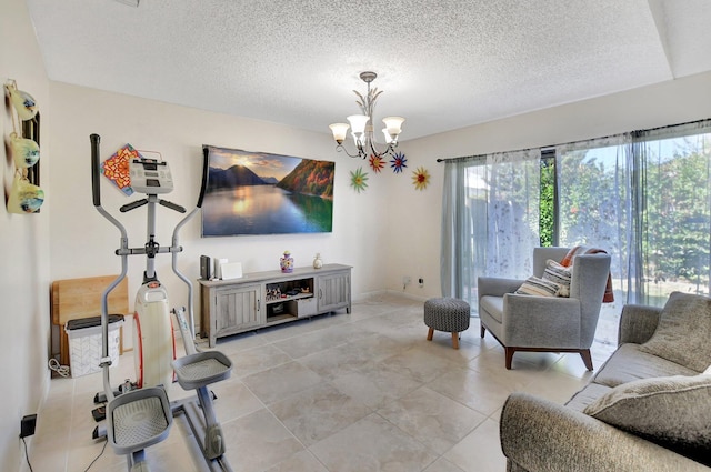 living room featuring a notable chandelier, light tile patterned flooring, and a textured ceiling