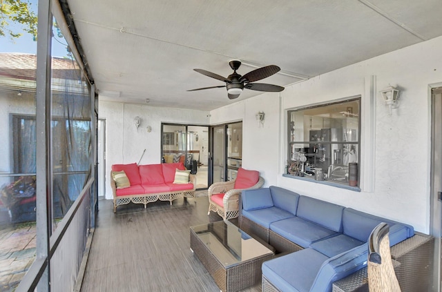 sunroom / solarium with ceiling fan