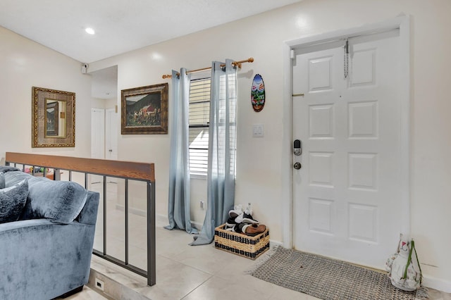 foyer featuring light tile patterned floors